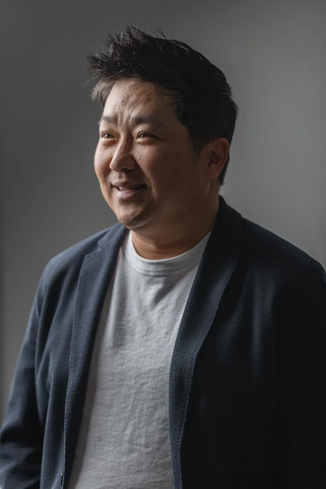 Founder portrait on a grey backdrop