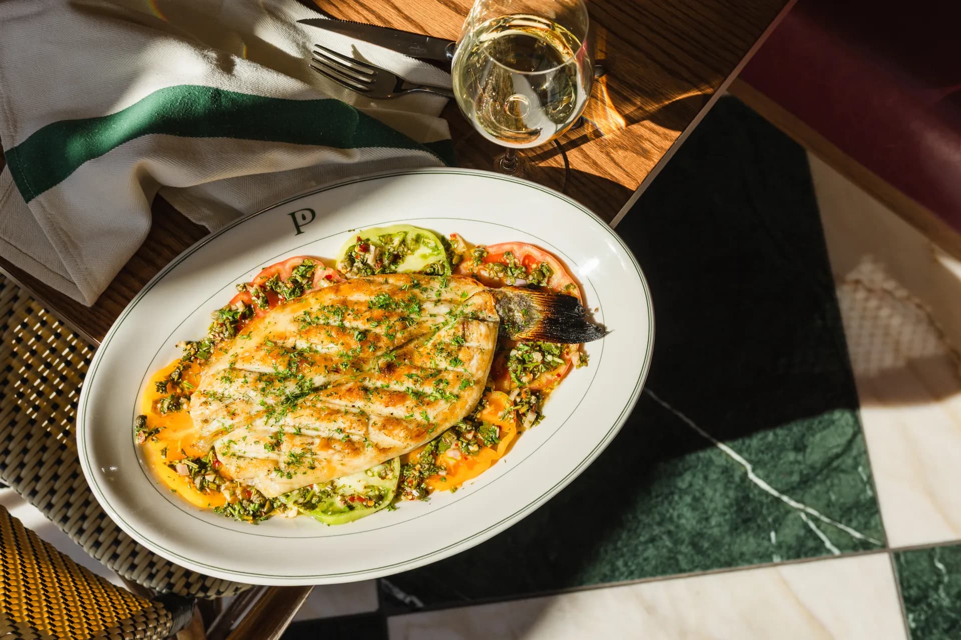 Plated entrée with white wine