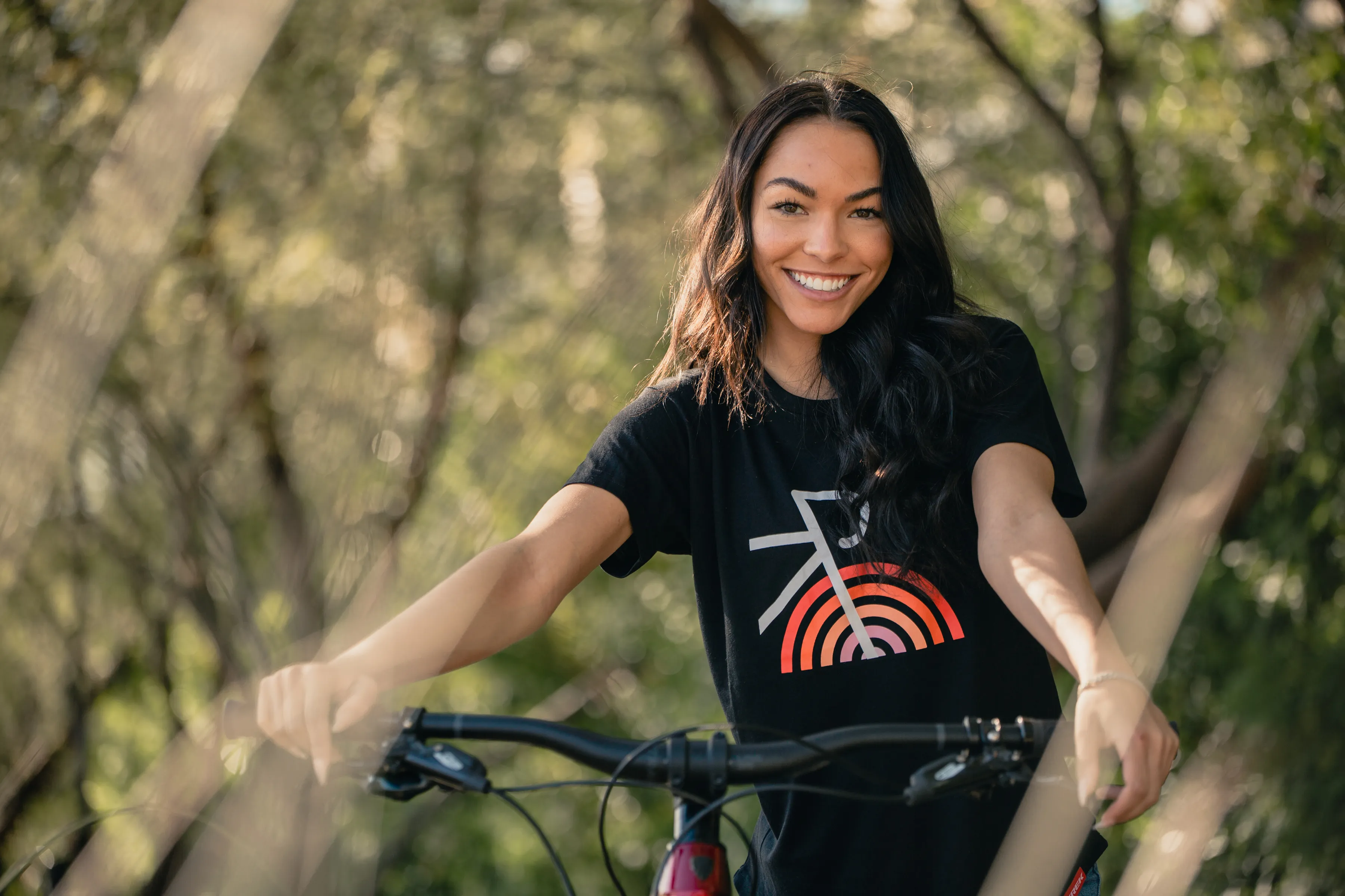 Cyclist smiling in the forest